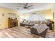 Spacious living room with a large sectional sofa, built-in shelving, and a ceiling fan at 1147 Wagner Ave, Fort Mill, SC 29715