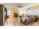 Spacious living room with a large sectional sofa, built-in shelving, and a ceiling fan at 1147 Wagner Ave, Fort Mill, SC 29715