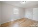 Bright bedroom with hardwood floors, a window, and neutral paint at 122 Lowry Row, York, SC 29745