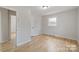 Cozy bedroom with hardwood floors and neutral walls at 122 Lowry Row, York, SC 29745