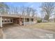Charming single-story brick home featuring a covered carport and cozy front porch at 122 Lowry Row, York, SC 29745
