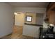 Bright kitchen with hardwood floors offering a pass through to the living area at 122 Lowry Row, York, SC 29745