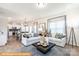 Open living space with hardwood floors, sectional sofa, and kitchen views at 6308 Honor Ave, Midland, NC 28107
