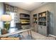 Home office with metal desk, built-in shelves and window at 6308 Honor Ave, Midland, NC 28107
