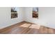 Well-lit bedroom with hardwood floors and backyard view at 1314 Ordermore Ave, Charlotte, NC 28203