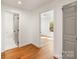 Bright hallway with hardwood floors and access to rooms at 1314 Ordermore Ave, Charlotte, NC 28203