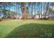 Spacious backyard with green lawn and trees at 134 Shipyard Pointe Rd, Mooresville, NC 28117