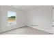 Bright bedroom with carpet and window overlooking open space at 1411 5Th Street Ne Dr, Hickory, NC 28601