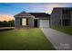 New single-story home with attached garage and landscaped lawn at 1411 5Th Street Ne Dr, Hickory, NC 28601