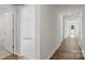 Light-filled hallway with wood floors and access to bedrooms at 1411 5Th Street Ne Dr, Hickory, NC 28601