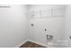 Laundry room with wire shelving and wood floor at 1411 5Th Street Ne Dr, Hickory, NC 28601
