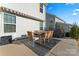 Patio with table, chairs, and grill; view of house exterior at 143 Tetcott St, Mooresville, NC 28115