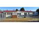 Mobile home with red metal roof, deck, and fenced yard at 1590 George Brown Rd, Crouse, NC 28033