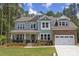 Two-story house with stone accents and a three-car garage at 1863 White Fawn Ln, Rock Hill, SC 29730