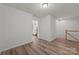 Upstairs hallway with light wood flooring and access to bedrooms at 19009 Sweet Crabapple Ln, Huntersville, NC 28078