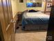 Cozy bedroom featuring a comfortable queen-sized bed and carpet floors at 212 W Bingham St, Statesville, NC 28677