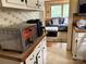 Partial kitchen view showing countertop appliances and open view to the living room at 212 W Bingham St, Statesville, NC 28677