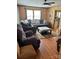 Cozy living room with wood paneling, plush seating, and a stylish ottoman creating a welcoming space at 212 W Bingham St, Statesville, NC 28677