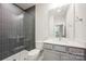 Stylish bathroom featuring tiled shower and modern vanity at 225 Davidson Gateway Dr, Davidson, NC 28036