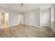 Bright bedroom features sleek ceiling fan and wood-look flooring at 225 Davidson Gateway Dr, Davidson, NC 28036