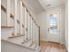 Inviting entryway with a staircase and light wood floors, showcasing the bright and welcoming atmosphere at 225 Davidson Gateway Dr, Davidson, NC 28036