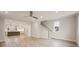 Open-concept design showing kitchen and stairs, plus large windows for ample natural light at 225 Davidson Gateway Dr, Davidson, NC 28036