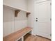 Mudroom features a bench, shelf, and coat hooks by the door at 225 Davidson Gateway Dr, Davidson, NC 28036