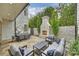 Cozy patio with seating area next to an outdoor fireplace at 238 Laurel S Ave # A, Charlotte, NC 28207