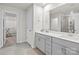 Modern bathroom with double vanity, large mirror and walk-in shower at 310 Hyssop Ct, Fort Mill, SC 29715
