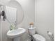 Clean and bright bathroom with pedestal sink and toilet at 310 Hyssop Ct, Fort Mill, SC 29715