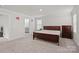 Spacious bedroom with carpeted floors and en-suite bathroom access at 310 Hyssop Ct, Fort Mill, SC 29715