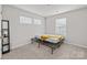 Simple bedroom with a twin bed and plenty of natural light at 310 Hyssop Ct, Fort Mill, SC 29715