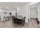 Kitchen and dining area with hardwood floors and gray cabinets at 310 Hyssop Ct, Fort Mill, SC 29715