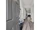 Open entryway with gray door and view to living room at 310 Hyssop Ct, Fort Mill, SC 29715