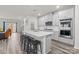 Modern kitchen with gray cabinets, island, and stainless steel appliances at 310 Hyssop Ct, Fort Mill, SC 29715