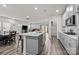 Modern kitchen with gray cabinets, island, and stainless steel appliances at 310 Hyssop Ct, Fort Mill, SC 29715