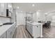 Modern kitchen with gray cabinets, island, and stainless steel appliances at 310 Hyssop Ct, Fort Mill, SC 29715