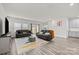 Spacious living room with hardwood floors and gray sectional at 310 Hyssop Ct, Fort Mill, SC 29715