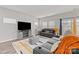 Spacious living room featuring comfortable seating and a large TV at 310 Hyssop Ct, Fort Mill, SC 29715