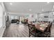 Open living area with hardwood floors and gray sectional sofa at 310 Hyssop Ct, Fort Mill, SC 29715