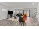 Open living area with gray sectional and access to backyard at 310 Hyssop Ct, Fort Mill, SC 29715