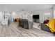 Spacious living area with hardwood floors and gray sectional sofa at 310 Hyssop Ct, Fort Mill, SC 29715