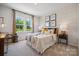 Secondary bedroom with bed and chevron patterned wall at 3103 Beacon Heights Rd, Indian Land, SC 29707