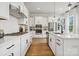 Modern kitchen with white cabinets and stainless steel appliances at 3103 Beacon Heights Rd, Indian Land, SC 29707