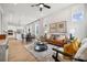 Open living space with leather couch and large windows at 3103 Beacon Heights Rd, Indian Land, SC 29707