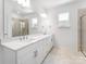 Elegant Primary bathroom with double sinks, quartz countertop, and glass shower at 3107 Beacon Heights Rd, Indian Land, SC 29707