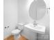 Modern bathroom featuring a sleek pedestal sink and fixtures at 3107 Beacon Heights Rd, Indian Land, SC 29707