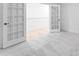 This bedroom features light-colored walls, plush gray carpeting, and french doors at 3107 Beacon Heights Rd, Indian Land, SC 29707