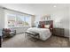 Bright bedroom with large windows, modern decor, and plush seating area at 3107 Beacon Heights Rd, Indian Land, SC 29707
