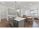 Open concept kitchen featuring a large island, pendant lighting, and stylish finishes at 3107 Beacon Heights Rd, Indian Land, SC 29707